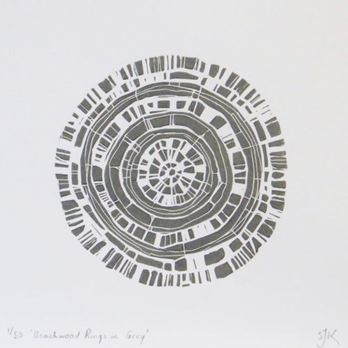 Hand printed linocut by artist Sarah Knight. Beachwood Rings is available in grey, in an optional navy blue frame.